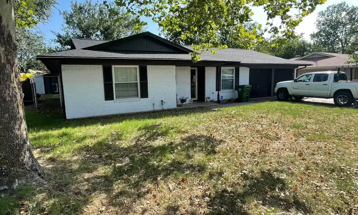 Professional roofing crew working on a residential roof in Upper Milford